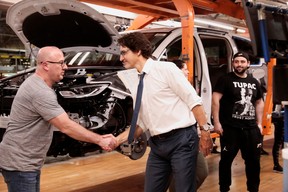 Canadian Prime Minister Justin Trudeau greets a Stellantis auto assembly worker during a tour of the Windsor Assembly Plant in Windsor, Ontario, Canada on January 17, 2023